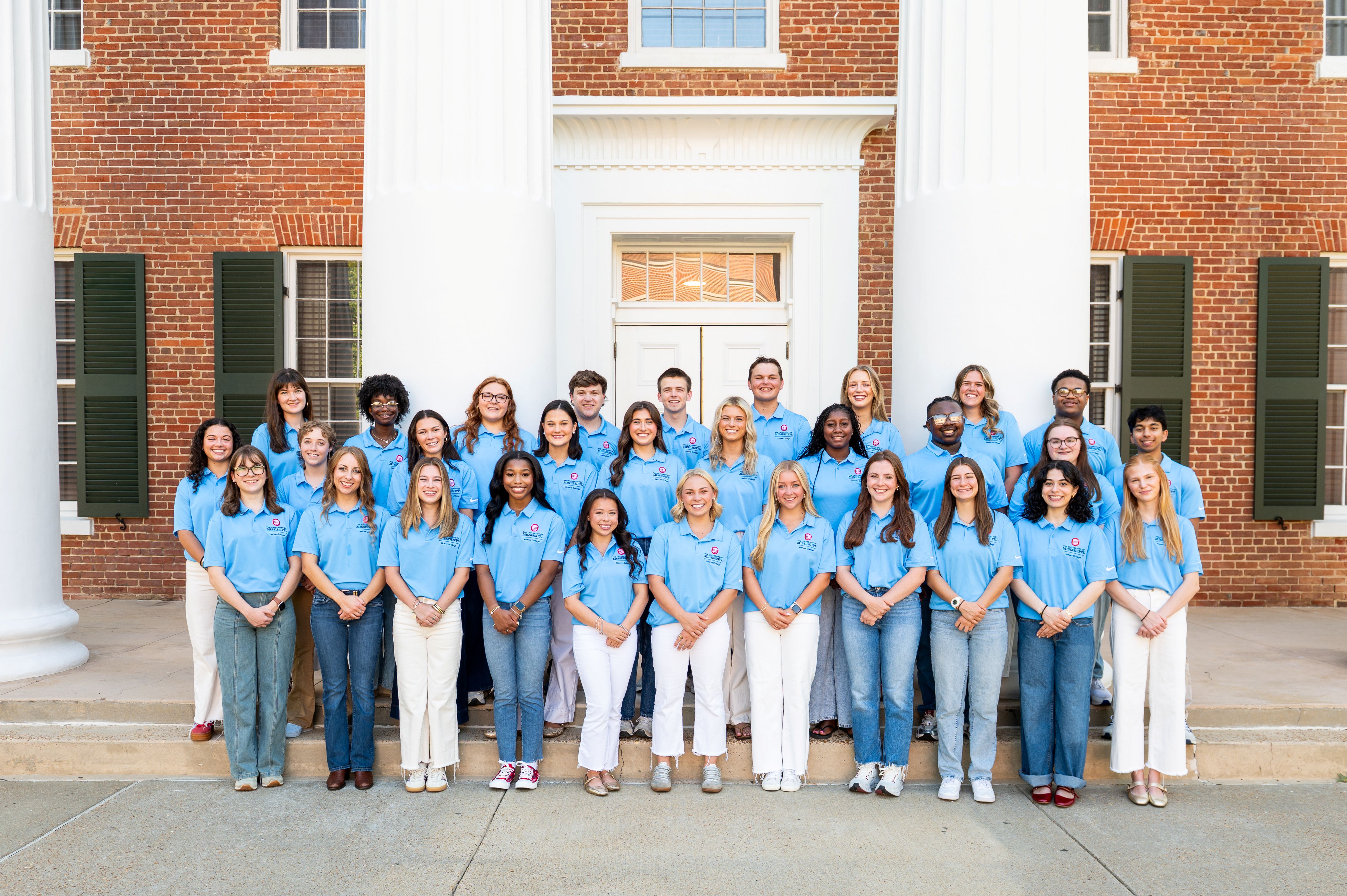 Members of the Honors College Ambassadors team stand on the Lyceum steps